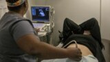 FILE - A technician performs an ultrasound on a pregnant patient in Shreveport, La., Wednesday, July 6, 2022. (AP Photo/Ted Jackson, File)