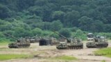 South Korean army K-9 self-propelled howitzers take positions in Paju, near the border with North Korea, South Korea, Monday, Aug. 22, 2022. (AP Photo/Ahn Young-joon)