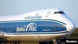 FILE - An AirBridgeCargo Airlines Boeing 747-87U arrives at Paris Charles de Gaulle airport in France, May 25, 2020.