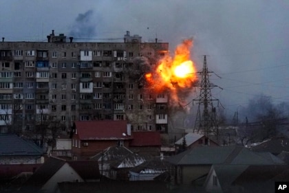 An explosion at an apartment building in Mariupol after a Russian army tank fires, March 11, 2022.  