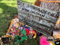 A makeshift memorial for the dozens of Indigenous children who died more than a century ago while attending a boarding school in New Mexico. (AP Photo/Susan Montoya Bryan, File)