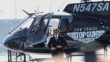 FILE - Tom Cruise arrives at the opening for the film Top Gun: Maverick on the USS Midway Museum in San Diego, California, U.S., May 4, 2022. (REUTERS/Mario Anzuoni)