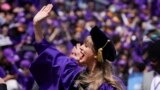 Taylor Swift waves to students at NYU's commencement on May 18, 2022. (AP Photo/Seth Wenig)