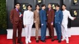 FILE - Members of the South Korean K-pop band BTS pose for a photo as they arrive for the 64th Annual Grammy Awards at the MGM Grand Garden Arena in Las Vegas, Nevada, April 03, 2022. 