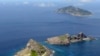 资料照片：日本共同社2012年9月拍摄的照片显示东中国海的尖阁诸岛(中国称为钓鱼岛及附属岛屿)。