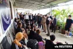 FILE - Pol Lt Gen Surachate Hakparn, Assistant to Thai Police Commissioner speaks to Thai victims rescued from scam call centres in Phnom Penh, Cambodia, in this undated handout picture released by Thai police on April 12, 2022. (Thai Police/ Handout via REUTERS)