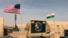 Les drapeaux des États-Unis et du Niger flottent côte à côte dans un camp militaire à Agadez, au Niger, le 16 avril 2018.
