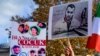 (FILE) People hold portraits of Iranian rapper Toomaj Salehi, right, and children, left, who were killed during the protests in Iran, during a rally in Istanbul, on Nov. 26, 2022. 