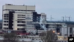 FILE - In this handout photo, a fire is seen at the Zaporizhzhia nuclear plant - the largest in Europe - after it was attracted by Russian forces early on Friday morning Energodar, Ukraine, March 4, 2022. (National Nuclear Energy Generation Company Energoatom via AP)