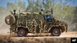Бронетранспортер Bushmaster австралийской армии во время учений 7 июля 2021 года в Таунсвилле, Австралия