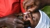 A baby receives a polio vaccine during the Malawi Polio Vaccination Campaign Launch, in Lilongwe Malawi, Sunday March 20, 2022. A drive to vaccinate more than 9 million children against polio has been launched this week in four countries in southern and e