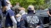 Арестованная полицией группа ультрправых в Айдахо. 11 июня 2022 г.
