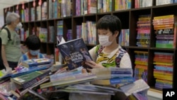 The Hong Kong Book Fair, one of Asia's largest book fairs, offers a variety of books but this year there are fewer political books and publishers as authorities have tightened controls on freedom of expression.