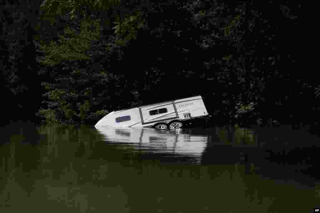 A camper vehicle is seen partly under water in Carr Creek Lake, Aug. 3, 2022, near Hazard, Kentucky, USA.