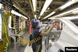 FILE -- The decline of good-paying factory jobs is contributing to record levels of stress and unhappiness, according to a Gallup research scientist.