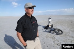 Kevin Perry, a professor of atmospheric sciences at the University of Utah, stands on the dried out lakebed of Farmington Bay of the Great Salt Lake near Syracuse, Utah, U.S., July 1, 2022. (REUTERS/Nathan Frandino)