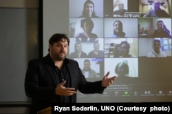 FILE - Jonathan Santo teaches adolescent development, statistics, and cross-cultural psychology at the University of Nebraska at Omaha. Santo is seen here on Aug. 2, 2020, at UNO.