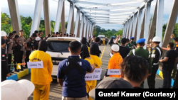 FILE - Rekonstruksi kasus pembunuhan dan mutilasi di Mimika, Timika, Papua digelar Sabtu (3/9/2022). (Foto: Courtesy/Gustaf Kawer) 