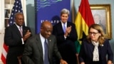 (L-R) Ghana President John Dramani Mahama, Ghana Finance Minister Seth Terkper, U.S. Secretary of State John Kerry and Dana Hyde, CEO of the Millennium Challenge Corporation (MCC), participate in the Ghana Compact Signing Ceremony at the State Department, Washington, DC, Aug. 5, 2014.