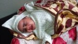 Hemen Hagos, 1.5 months old Ethiopian child admitted with pertussis, also known as whooping cough, receives care at a hospital in Mekelle, the capital of Tigray region, Ethiopia September 9, 2022. (REUTERS/Stringer)