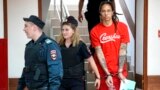 WNBA star and two-time Olympic gold medalist Brittney Griner is escorted to a courtroom for a hearing, in Khimki just outside Moscow, Russia, July 7, 2022. (AP Photo/Alexander Zemlianichenko)