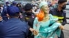 Cambodian-US human rights advocate Theary Seng, dressed as Lady Liberty, is arrested by police after being found guilty of treason in her trial in front of the Phnom Penh municipal court on June 14, 2022. (Photo by Samuel / AFP)