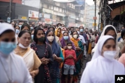 Indian Christians wearing masks as a precaution against COVID-19 gather for prayers as they observe Palm Sunday in Kochi, Kerala state, India, April 10, 2022. (AP Photo/R S Iyer, File)