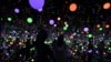 Visitors visit an art installation by Japanese artist Yayoi Kusama entitled "Infinity Mirrored Room - Brilliance of the Souls" at the Museum MACAN (Modern and Contemporary Art Museum) in Jakart, Malaysia, June 30, 2022. 