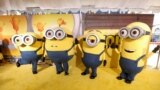 FILE - People dressed as the characters Bob, Otto, Stuart and Kevin pose on the red carpet for "Minions: The Rise of Gru" at the TCL Chinese Theater in Los Angeles, California, U.S., June 25, 2022. (REUTERS/David Swanson/File Photo)