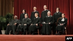 In this photo taken Oct. 8, 2012, the justices of the U.S. Supreme Court gather for a group portrait at the Supreme Court Building in Washington.