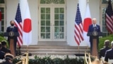 Japan's Prime Minister Yoshihide Suga and U.S. President Joe Biden hold a joint news conference in the Rose Garden at the White House in Washington, U.S., April 16, 2021. 
