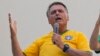 El expresidente de Brasil Jair Bolsonaro habla ante sus simpatizantes durante una marcha, el domingo 25 de febrero de 2024, en Sao Paulo. Oficiales de alto rango declararon a la policía que el expresidente les presentó un plan para anular los resultados de la elección de 2022.