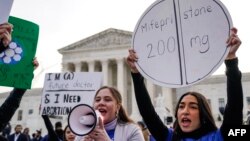Abortion rights activists rally in front of the U.S. Supreme Court on March 26, 2024, in Washington. 