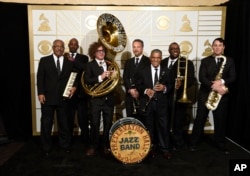 The Preservation Hall Jazz Band poses in the press room at the 58th annual Grammy Awards in Los Angeles, on Feb. 15, 2016.