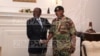 In this handout photos, President Robert Mugabe poses with General Constantino Chiwenga at State House in Harare, Zimbabwe, Nov. 16, 2017. 