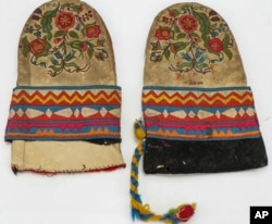 This undated photo provided on Wednesday, July 20, 2022, by Gregory Scofield, shows two mittens he made in the late 19th-century Cree-Metif native Canadian traditional style. The Vatican's Anima Mundi Ethnological Museum houses tens of thousands of artifacts and art made by Indigenous peoples from around the world. (Gregory Scofield via AP)