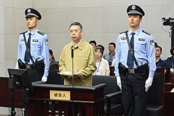This handout photo taken on June 20, 2019 and released by the Tianjin No.1 Intermediate Court