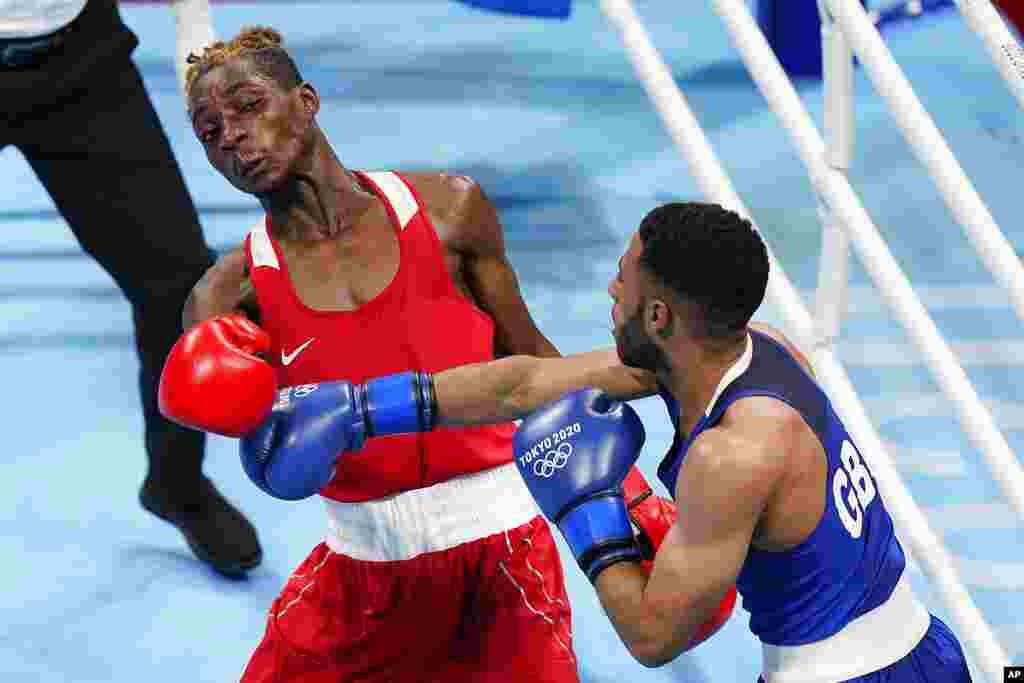 Zambia&#39;s Patrick Chinyemba, left, exchanges punches with Britain&#39;s Galal Yafai during their men&#39;s flyweight 52-kg boxing match at the 2020 Summer Olympics, Saturday, July 31, 2021, in Tokyo, Japan. (AP Photo/Frank Franklin II)