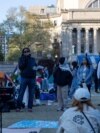 Frank Guridy, a Columbia University history professor who teaches a course called "Columbia 1968," speaks to students at the protest encampment on campus, maintained by student protesters of the Israel-Hamas war, in New York on April 25, 2024.