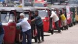 FILE- Sri Lankan drivers line up to buy fuel near a fuel station in Colombo, Sri Lanka on April 13, 2022. (AP Photo/Eranga Jayawardena, File)