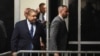 Manhattan District Attorney Alvin Bragg, left, returns to the courtroom following a break during a hearing about Donald Trump's hush money trial at Manhattan Criminal Court in New York on March 25, 2024. Bragg sought, and was granted, a gag order against Trump.