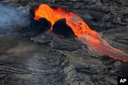 A fountain of lava erupts from Hawaii's Kilauea volcano's Tuesday, July 8, 2008. (AP Photo/Tim Wright)
