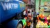 (FILE) People fill drinking water from a water tanker truck in Chennai, in the Southern Indian state of Tamil Nadu.