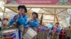 资料照：2023年3月10日，星期五，印度达兰萨拉，流亡西藏学生在纪念起义64周年的集会上演奏国歌。（美联社）
