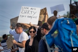 FILE - Residents of the Blairgowrie neighborhood of Johannesburg, South Africa, demonstrate against the lack of water on March 12, 2024.