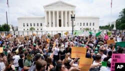 Protesters gather outside the Supreme Court in Washington, Friday, June 24, 2022. The Supreme Court has ended constitutional protections for abortion that had been in place nearly 50 years. (AP Photo/Jacquelyn Martin)