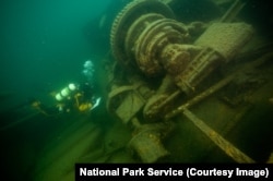 A diver explores a shipwreck at Isle Royale National Park