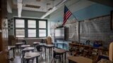 FILE - An empty elementary school classroom is seen on Tuesday, Aug. 17, 2021 in the Bronx borough of New York. (AP Photo/Brittainy Newman, File)