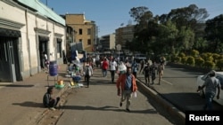 FILE—Residents walk along the street in Piassa neighborhood of Addis Ababa, Ethiopia November 4, 2020.