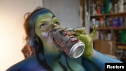 FILE - A person with airbrushed body paint.